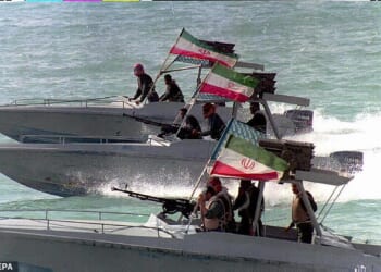 Iranian Revolutionary Guards man their speedboats in the Persian Gulf off the port of Bandar Abbas (file photo)