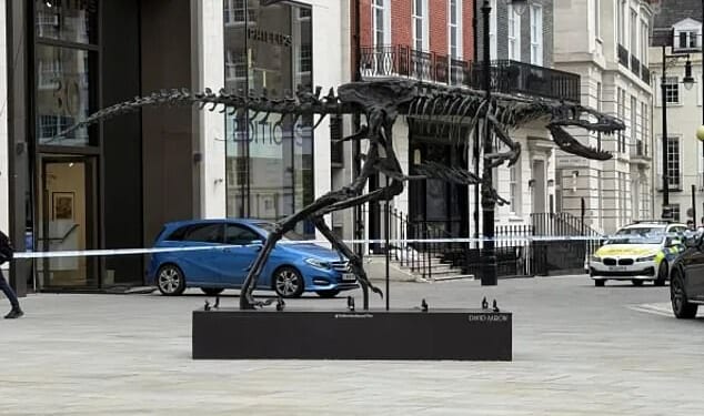 It was one of the most audacious robberies in London: a blue Mercedes driving full speed into the reinforced glass doors of Phillips Auction House, a high-end art dealer in Berkeley Square, Mayfair. Pictured: Police outside the building in June last year after the break-in on May 26