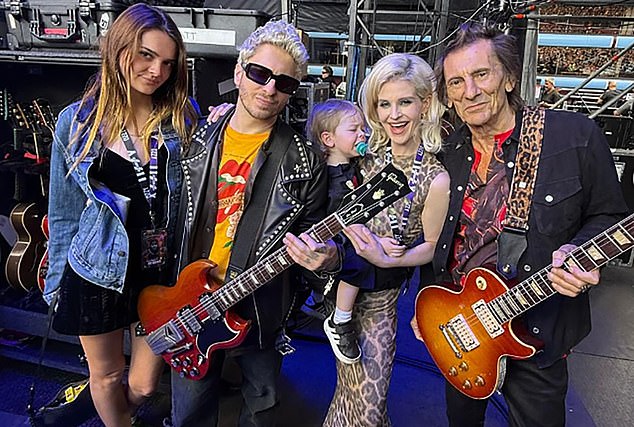 Kelly and Sidney Jr backstage with guitarists Andrew Watt and Ronnie Wood at her dad Ozzy's final gig with Black Sabbath at Villa Park in Birmingham in July last year