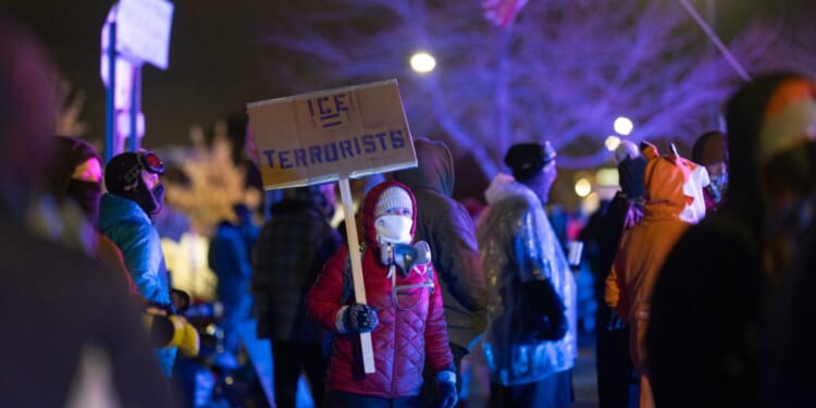 Anti-ICE agitators form a crowd outside of the Whipple federal building in Minneapolis, Minnesota, on Jan. 17, 2026.