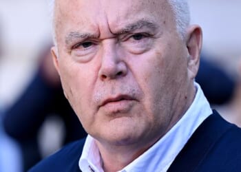 Former BBC presenter Huw Edwards leaves court after being handed a six-month suspended jail sentence for child abuse image offences in 2024