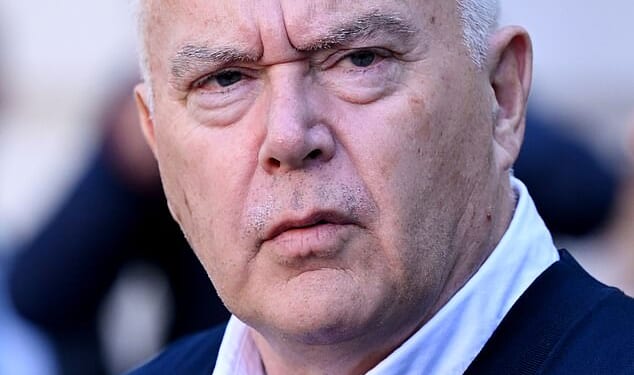 Former BBC presenter Huw Edwards leaves court after being handed a six-month suspended jail sentence for child abuse image offences in 2024