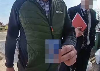 Doorcam footage of the police visiting Helen Jones's house following a complaint about her social media post