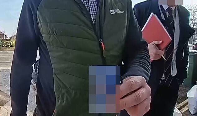 Doorcam footage of the police visiting Helen Jones's house following a complaint about her social media post