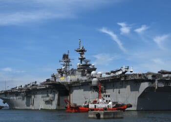 The US Navy's USS Tripoli amphibious assault ship is seen during a port call at the Port Area in Manila on Sept. 27, 2022.