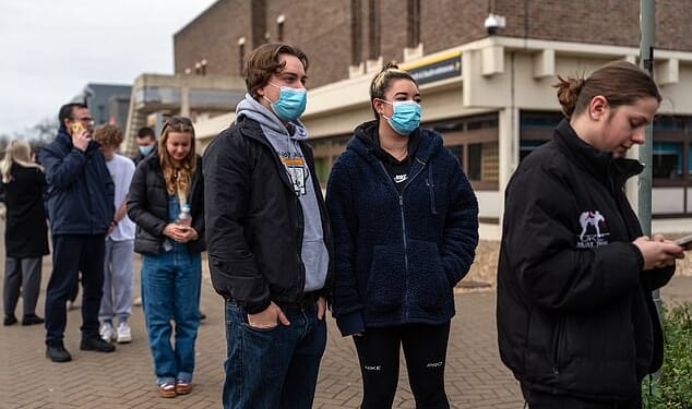 Students queue at the University of Kent in Canterbury today amid the meningitis outbreak