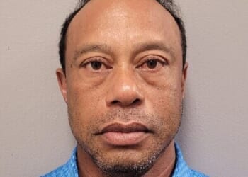 Tiger Woods stares down the lens in his police mugshot after being arrest for DUI on Friday afternoon