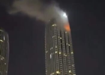 A tourist and his father have been arrested in Dubai for posting war videos before the population was ordered to keep them off social media. Pictured: Creek Harbour hotel in Dubai following an Iranian drone strike