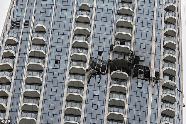 On Thursday morning a high-rise building in Creek Harbour, Dubai, was pictured with a large hole after a drone strike