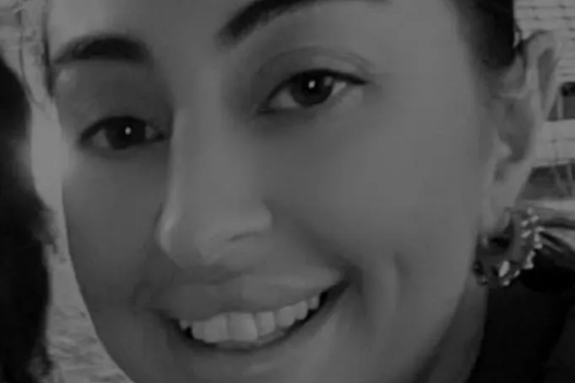 An image collage containing 1 images, Image 1 shows Black and white close-up of Sian Sanghera smiling