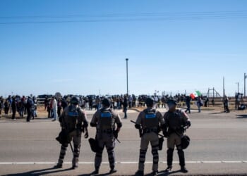 Texas State Troopers secure the area after dispersing a crowd protesting Immigration and Customs Enforcement at the South Texas Family Residential Center on Jan. 28, 2026, in Dilley, Texas.