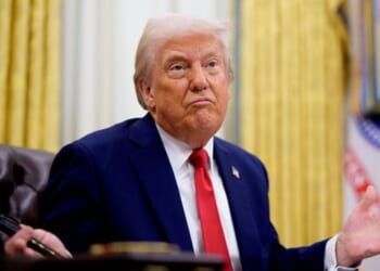 President Trump shrugs in the Oval Office at the Resolute Desk on March 31, 2025.