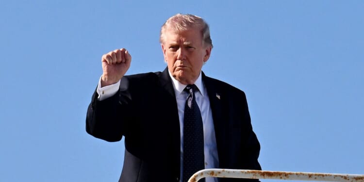 President Donald Trump boards Air Force One at Palm Beach International Airport on March 1, 2026, in West Palm Beach, Florida.