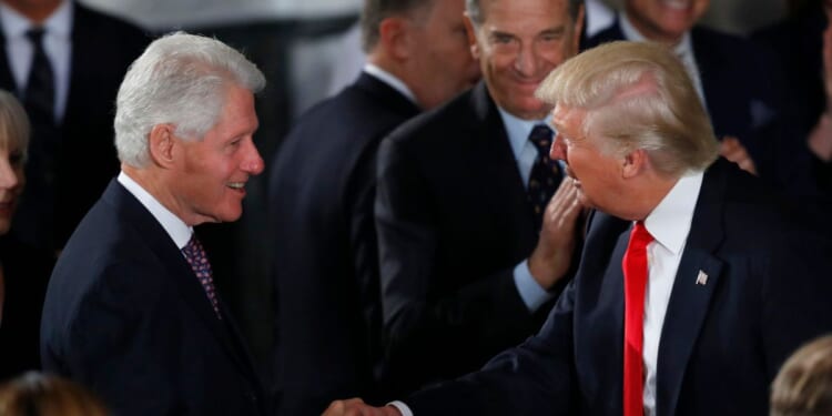 President Donald Trump greets former President Bill Clinton at the Inaugural Luncheon in the U.S. Capitol on Jan. 20, 2017, in Washington, D.C.