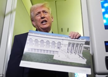 President Donald Trump holds up an image of his proposed ballroom during an Air Force One trip on Sunday
