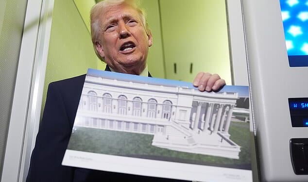 President Donald Trump holds up an image of his proposed ballroom during an Air Force One trip on Sunday