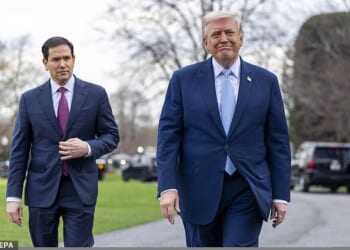 President Donald Trump (right) speaks with reporters outside the White House Friday alongside Secretary of State Marco Rubio (left). During the Q&A he said that the US doesn't 'use' the Strait of Hormuz