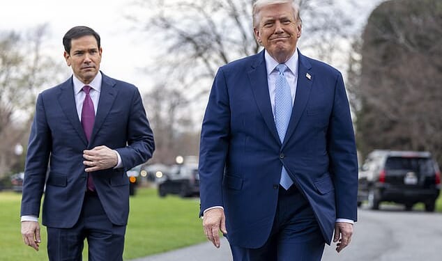 President Donald Trump (right) speaks with reporters outside the White House Friday alongside Secretary of State Marco Rubio (left). During the Q&A he said that the US doesn't 'use' the Strait of Hormuz