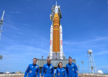 In this handout provided by NASA, NASA astronauts Reid Wiseman, Artemis II commander, left, Victor Glover, Artemis II pilot, Christina Koch, Artemis II mission specialist, and Canadian Space Agency astronaut Jeremy Hansen, Artemis II mission specialist, right, stop for a group photograph as they visit NASA's Artemis II Space Launch System rocket and Orion spacecraft, on March 30, 2026, in Cape Canaveral, Florida.