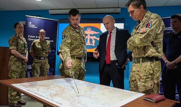 Defence Secretary John Healey is given a briefing as he meets military personnel during a visit to the Permanent Joint Headquarters in Northwood, North West London, today