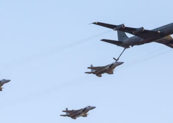 An Israeli KC-135 Stratotanker Boeing 707 plane refuels an F-15 fighter jet as they take part in an air show for a graduation ceremony at the Hatzerim base in the Negev desert, near the southern Israeli city of Beersheva, on Dec. 31, 2015.