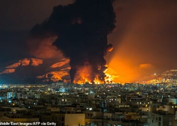 US State Department issued a warning to Americans worldwide to be cautious over concerns that groups supportive of Iran may target interests overseas (Pictured, flames rising from an oil depot struck by airstrikes in Tehran on March 7, 2026)