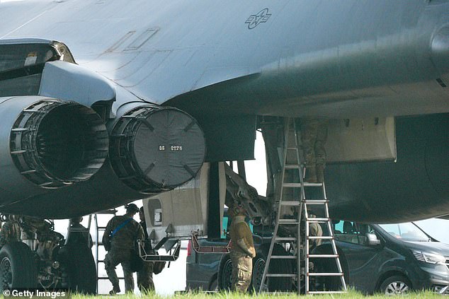 Personnel work on the bomb compartment of a B1 bomber on Tuesday as the US threatened its heaviest bombing campaign of the war with Iran so far