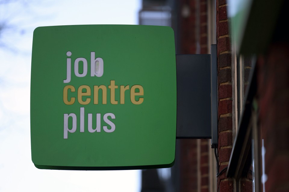 A green Jobcentre Plus sign outside a building.