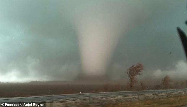 A massive tornado watch stretching more than 1,000 miles along the US East Coast has been issued on Monday as a dangerous storm system moves north. Pictured is a monster tornado that hit Indiana last week