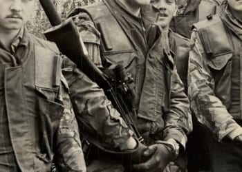 Patrick Mercer, 69, (pictured centre, holding a rifle) completed nine tours of Northern Ireland
