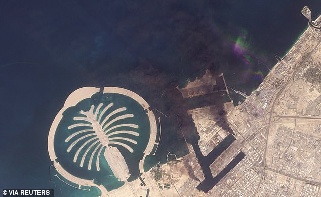 Reports confirmed debris from the missiles have so far hit major landmarks including Dubai International Airport, Burj Al Arab Hotel and Jebel Ali Port (pictured), as the the air defence team works to intercept the strikes