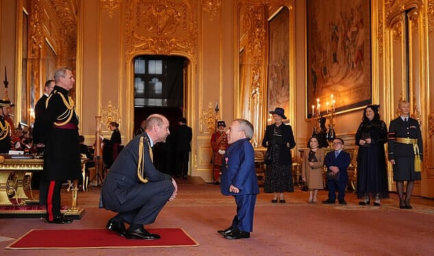 Warwick Davis was supported by a mystery woman as he accepted his OBE on Wednesday, after crediting a woman called 'Sponge' for 'helping him love again' following his wife's death