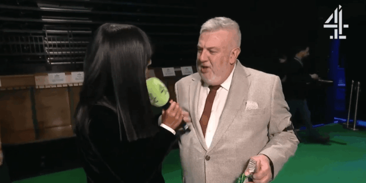 Watch the awkward moment Crufts winner accidentally hits Claudia Winkleman in the face with a microphone