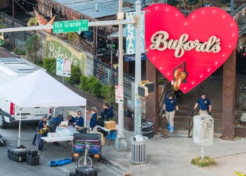 Members of the FBI conduct an investigation near Buford's bar Sunday in Austin, Texas. Two victims were killed and 14 others hospitalized following a mass shooting early Sunday morning. The gunman was also killed.