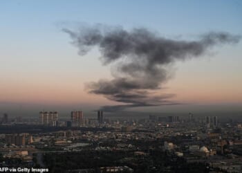 Smoke rises near Erbil International Airport, Iraq, which hosts US-led coalition troops, on Sunday