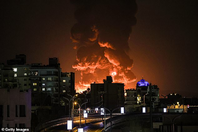 A fiery plume of smoke rises over Tehran as Israel and the US launched another wave of devastating strikes