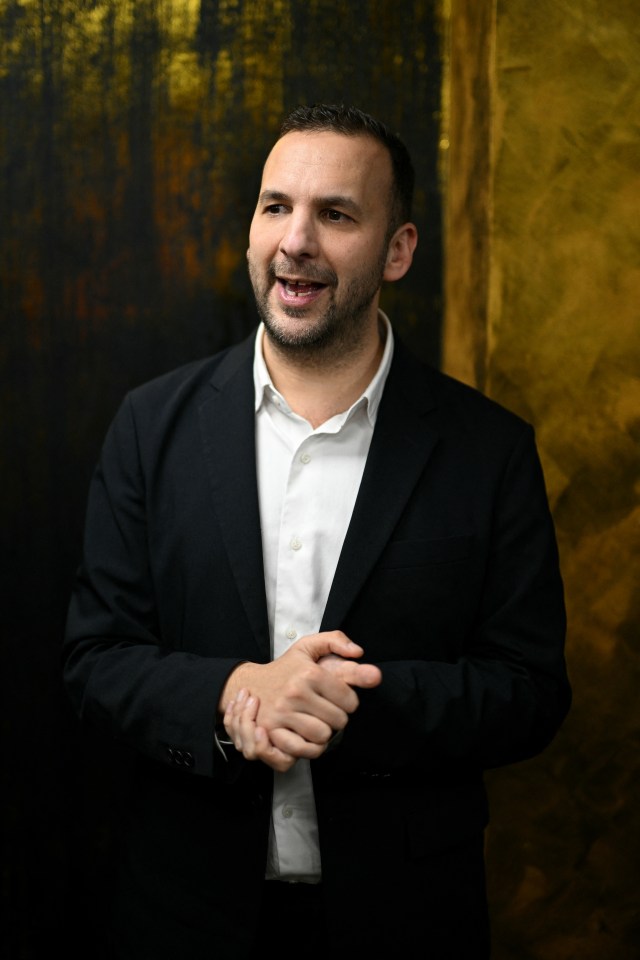 Zack Polanski, Leader of Britain's Green Party, gesturing while speaking to the community.