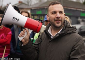 Green Party leader Zack Polanski talks with supporters outside the campaign headquarters in Manchester, United Kingdom on February 20