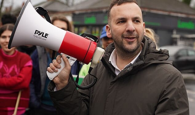 Green Party leader Zack Polanski talks with supporters outside the campaign headquarters in Manchester, United Kingdom on February 20