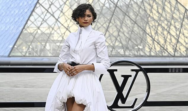 Zendaya flashed a gold 'wedding band' as she led the stars arriving at Louis Vuitton's Paris Fashion Week show on Tuesday