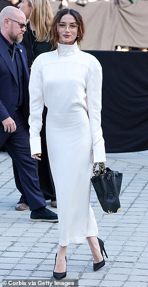 Ana de Armas arrived in a long-sleeved white dress with a high collar
