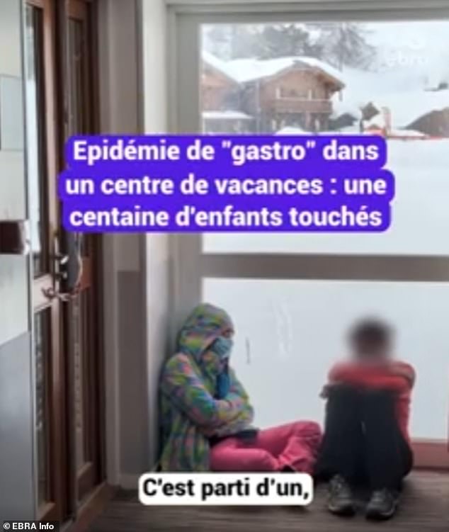 Those who have fallen ill are being treated in the centre. Pictured: A child with a face mask