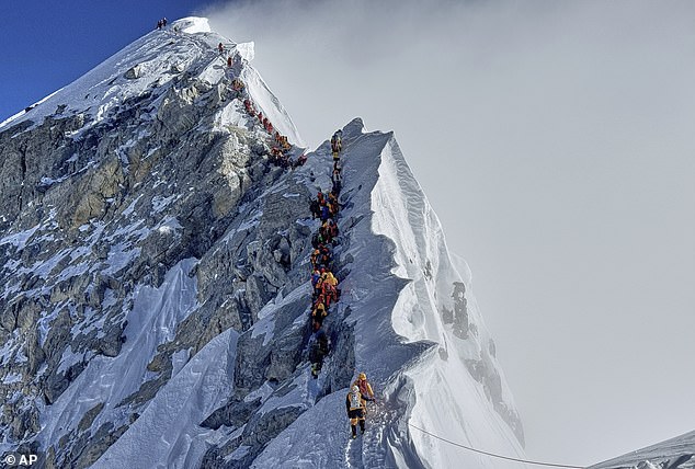 Mountaineers form a queue as they approach the summit of Mount Everest in Nepal, May 18, 2025