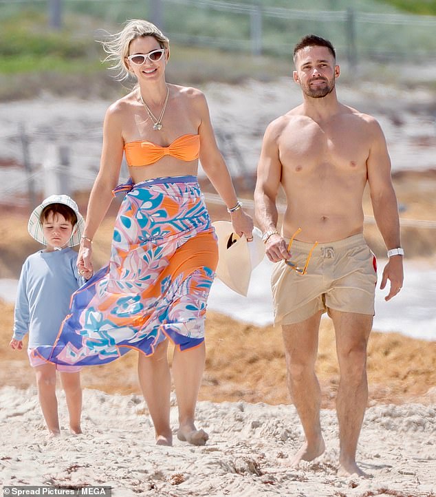 Vogue held Otto's hand as she made her way across the picturesque beach with Spencer on Tuesday