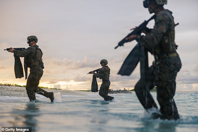 United States Marines conduct a simulated reconnaissance and surveillance mission at a naval support facility on March 24 in Diego Garcia, British Indian Ocean Territories