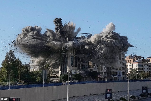 Smoke rises after an Israeli airstrike hits a building near the airport road in Beirut, Lebanon, Tuesday, March 31, 2026