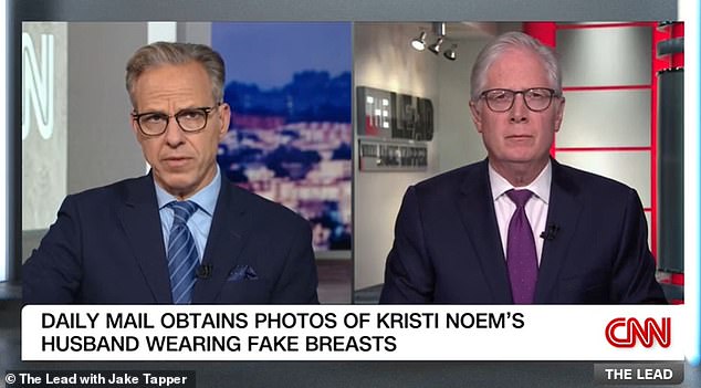 Jake Tapper, left, accompanied by CNN Correspondent Tom Foreman, right, who described the report and photographs as 'ricocheting all over DC'