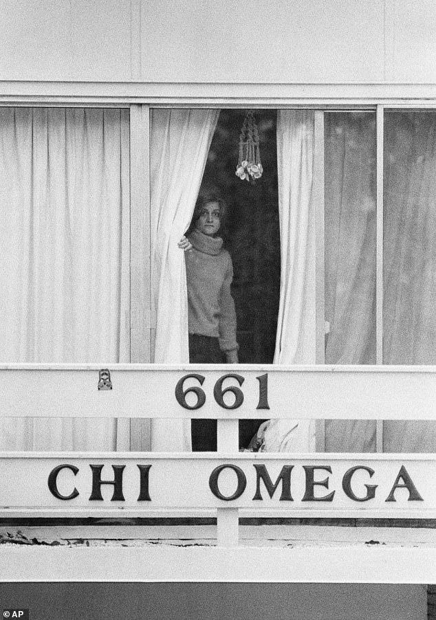A woman looks out of the second story balcony of the Chi Omega sorority house on January 15 1978 - hours after Bundy broke in and went on a violent rampage