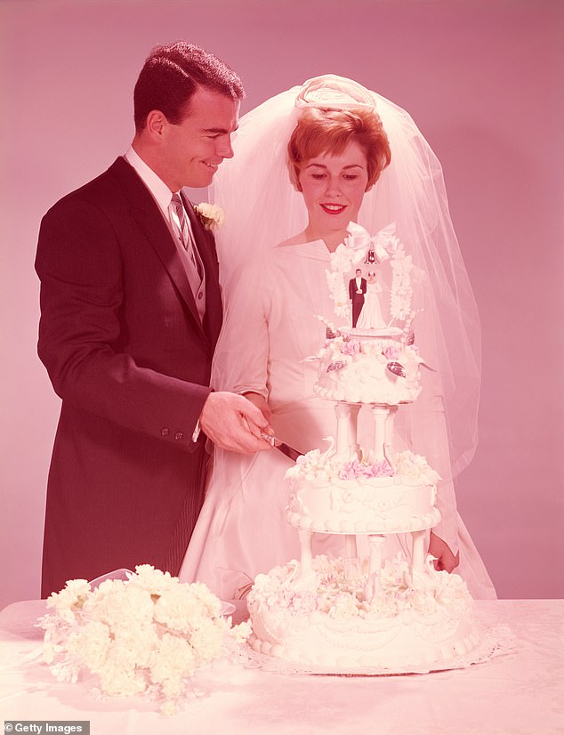The wedding cake: It will be traditional like seen here in this 1950s photo