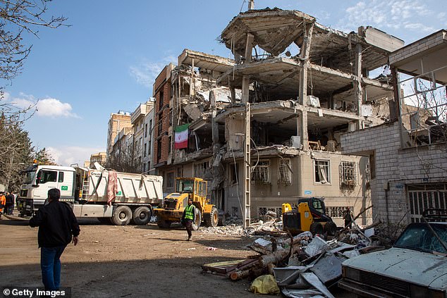 The aftermath of a drone attack on a residential building in which one civilian was killed is seen in Tehran on Tuesday